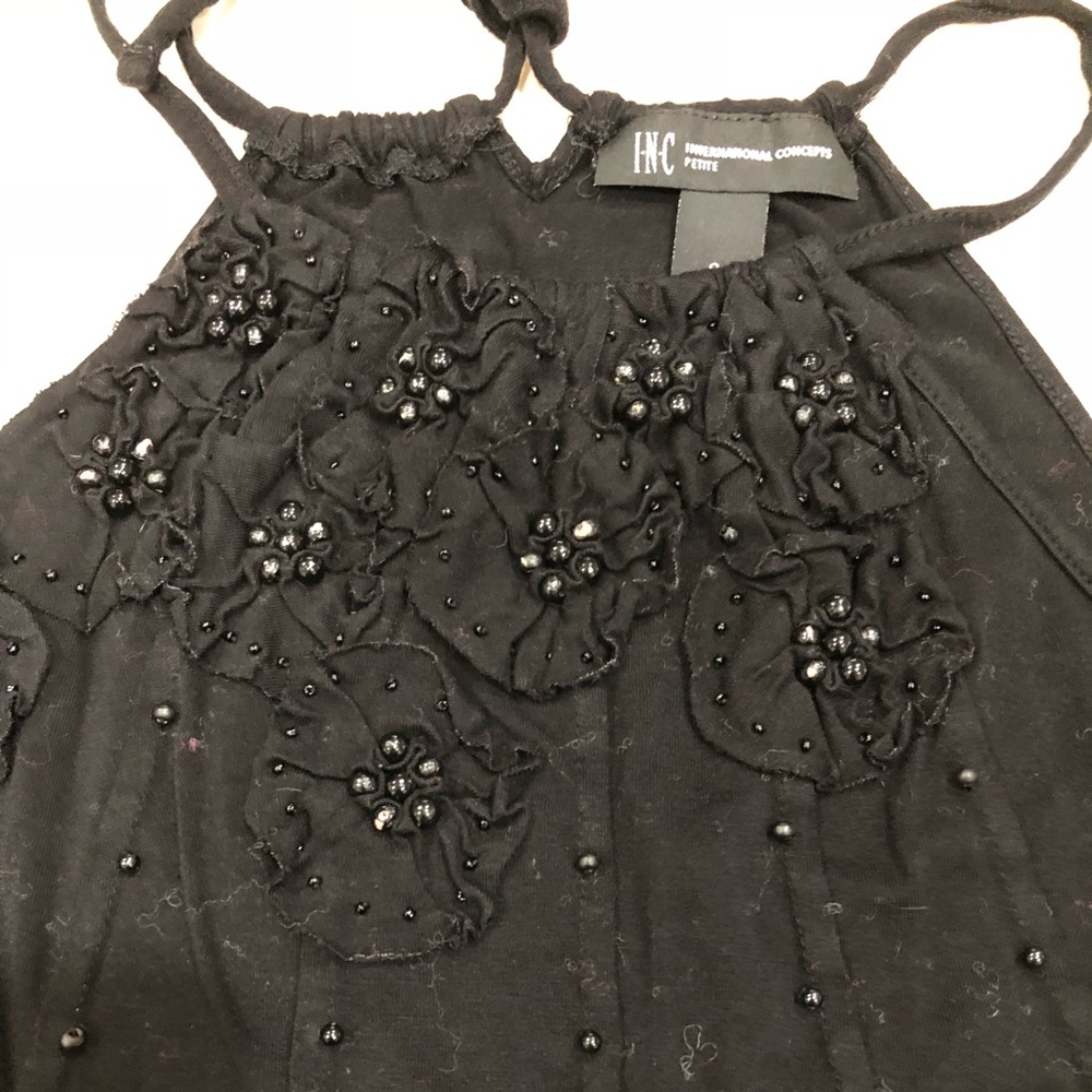Inc. Black strapped top.
